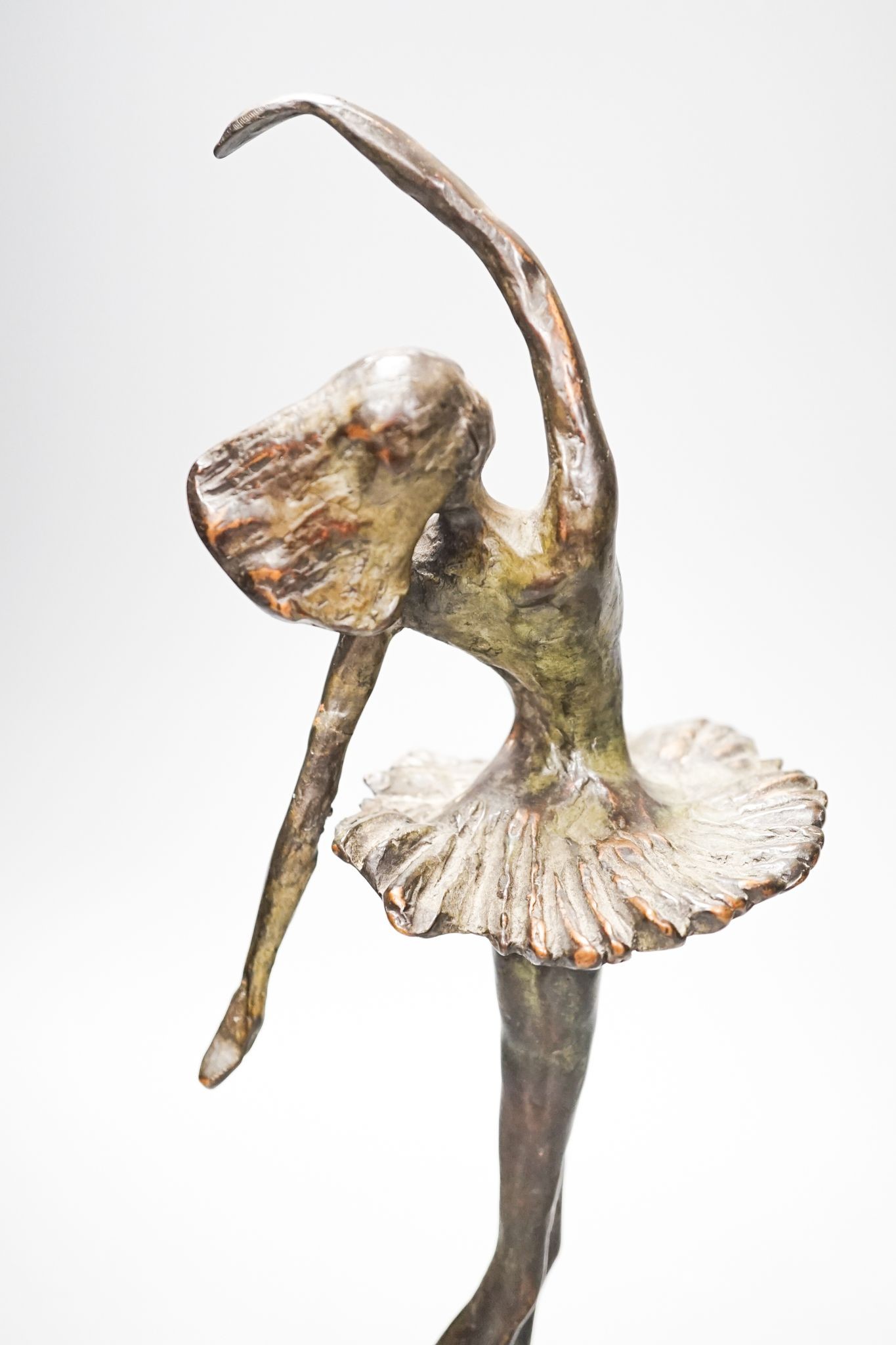 A 20th century bronze figure of a ballerina, indistinctly initialled CAN (?), 33cm